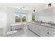 Bathroom with double vanity, clawfoot tub and tile floor at 73 W Lewis Ave, Phoenix, AZ 85003