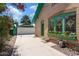 Brick house with a green garage and driveway at 73 W Lewis Ave, Phoenix, AZ 85003