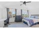 Spacious bedroom with a bed, desk, and large windows with city views at 73 W Lewis Ave, Phoenix, AZ 85003