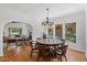 Elegant dining room features a round table and stained-glass windows at 73 W Lewis Ave, Phoenix, AZ 85003
