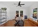 Home office with built-in shelving and a large wooden desk at 73 W Lewis Ave, Phoenix, AZ 85003