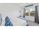 Comfortable bedroom with a queen-size bed and large windows at 73 W Lewis Ave, Phoenix, AZ 85003