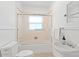 Clean bathroom with a shower/tub combo and pedestal sink at 73 W Lewis Ave, Phoenix, AZ 85003