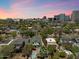 Aerial view of a home with a pool, and cityscape in the background at 73 W Lewis Ave, Phoenix, AZ 85003