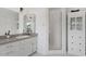 Bright bathroom with white cabinets, granite countertop, and a shower stall at 73 W Lewis Ave, Phoenix, AZ 85003