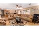 Bright living room with large sectional sofa and access to backyard at 2104 E 36Th Ave, Apache Junction, AZ 85119