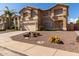 Two-story house with a two-car garage and cactus landscaping at 2104 E 36Th Ave, Apache Junction, AZ 85119