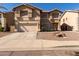 Two-story house with a two-car garage and desert landscaping at 2104 E 36Th Ave, Apache Junction, AZ 85119