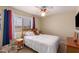 bedroom with sports-themed decor and a ceiling fan at 2104 E 36Th Ave, Apache Junction, AZ 85119