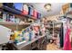 Laundry room with washer, dryer, and ample storage shelving at 2104 E 36Th Ave, Apache Junction, AZ 85119