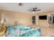 Bright bedroom featuring a ceiling fan and ensuite bathroom access at 2104 E 36Th Ave, Apache Junction, AZ 85119