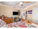 Bright bedroom with a double bed, TV, and built-in shelving at 2104 E 36Th Ave, Apache Junction, AZ 85119