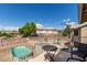 Covered patio with seating area, fire pit, and backyard views at 2104 E 36Th Ave, Apache Junction, AZ 85119