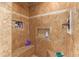 Spacious shower with built-in shelves and tiled walls at 2104 E 36Th Ave, Apache Junction, AZ 85119