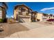 Two-story house with a two-car garage and desert landscaping at 2104 E 36Th Ave, Apache Junction, AZ 85119