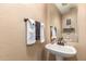 Clean powder room, featuring a pedestal sink and decorative accents at 2104 E 36Th Ave, Apache Junction, AZ 85119