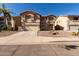 Two-story house with a two-car garage and desert landscaping at 2104 E 36Th Ave, Apache Junction, AZ 85119