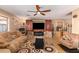 Gathering room with a barn door concealing a fireplace at 2104 E 36Th Ave, Apache Junction, AZ 85119