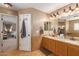 Bathroom with double vanity and access to the Primary bedroom at 2104 E 36Th Ave, Apache Junction, AZ 85119