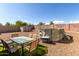 Backyard with a patio table, above ground pool and storage shed at 2104 E 36Th Ave, Apache Junction, AZ 85119