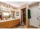 Double vanity bathroom with granite countertops and shower/tub combo at 2104 E 36Th Ave, Apache Junction, AZ 85119