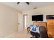 Home office with a rolltop desk, TV, and built-in file cabinet at 2104 E 36Th Ave, Apache Junction, AZ 85119