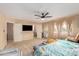 Primary bedroom with private balcony access and a wall-mounted TV at 2104 E 36Th Ave, Apache Junction, AZ 85119