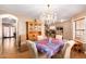 Formal dining room with chandelier and view into Gathering room at 2104 E 36Th Ave, Apache Junction, AZ 85119