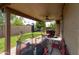 Covered patio with ceiling fan, outdoor furniture, and a trampoline at 5119 W Onyx Ave, Glendale, AZ 85302