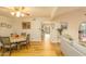 Bright dining room with hardwood floors and access to kitchen at 5119 W Onyx Ave, Glendale, AZ 85302