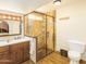 Updated bathroom with walk-in shower and double vanity at 5119 W Onyx Ave, Glendale, AZ 85302