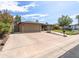 Spacious driveway with a large two-car garage and RV parking at 5119 W Onyx Ave, Glendale, AZ 85302