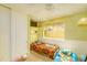 Second bedroom with two twin beds and window seat at 5119 W Onyx Ave, Glendale, AZ 85302