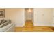 Long hallway with light-colored walls and hardwood floors at 5119 W Onyx Ave, Glendale, AZ 85302