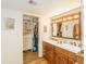 Bathroom with double vanity and large mirrored medicine cabinet at 5119 W Onyx Ave, Glendale, AZ 85302