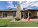 Spacious backyard with patio, covered seating area, and grassy lawn at 5119 W Onyx Ave, Glendale, AZ 85302