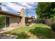 Large backyard with grassy area and patio at 5119 W Onyx Ave, Glendale, AZ 85302
