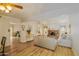 Living room with hardwood floors, fireplace, and ample natural light at 5119 W Onyx Ave, Glendale, AZ 85302