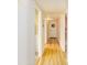 Light and bright hallway with wood-look flooring at 5119 W Onyx Ave, Glendale, AZ 85302