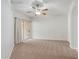 Comfortable bedroom with ceiling fan and access to balcony at 14575 W Mountain View Blvd # 221, Surprise, AZ 85374