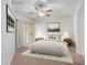 Spacious bedroom with ceiling fan and access to balcony at 14575 W Mountain View Blvd # 221, Surprise, AZ 85374