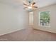 Bright bedroom with large window and ceiling fan at 14575 W Mountain View Blvd # 221, Surprise, AZ 85374