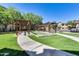 Community bocce ball court with pergola covered seating at 14575 W Mountain View Blvd # 221, Surprise, AZ 85374