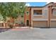 Two-story townhome with attached garage and landscaping at 14575 W Mountain View Blvd # 221, Surprise, AZ 85374