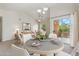Dining area with table and chairs, leading to patio at 14575 W Mountain View Blvd # 221, Surprise, AZ 85374