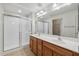 Double sink bathroom with large shower and linen closet at 14575 W Mountain View Blvd # 221, Surprise, AZ 85374