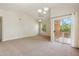 Bright living room with sliding glass door leading to balcony at 14575 W Mountain View Blvd # 221, Surprise, AZ 85374