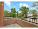 Private balcony overlooking trees and parking lot at 14575 W Mountain View Blvd # 221, Surprise, AZ 85374