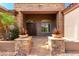 Inviting front entry with double doors and stone accents at 9845 E Inglewood St, Mesa, AZ 85207