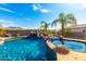 Stunning pool with waterfall, spa, and mountain views at 9845 E Inglewood St, Mesa, AZ 85207